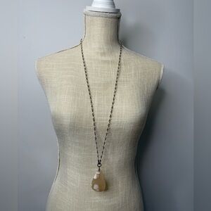 Long petite clear, pewter beaded necklace with a teardrop shaped marbled stone.
